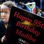Children hold placards as they gather to wish to former President Nelson Mandela happy birthday at a township school in Atteridgeville near Pretoria, July 18, 2013. Anti-apartheid hero Mandela is "steadily improving", South Africa's government said on Thursday as the former president celebrated his 95th birthday in hospital amid tributes from around the country and the world. REUTERS/Mike Hutchings
