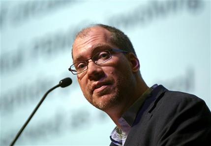 Timothy Henrich of the Harvard-affiliated Brigham and Women's Hospital in Boston speaks at the International AIDS Society Conference 2013 in Kuala Lumpur, Malaysia, Wednesday, July 3, 2013. Two HIV-positive patients in the United States who underwent bone marrow transplants for cancer have stopped anti-retroviral therapy and still show no detectable sign of the HIV virus, researchers said Wednesday. (AP Photo/Lai Seng Sin)