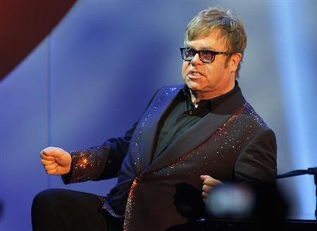 Musician Elton John acknowledges the audience during his performance at the 20th Annual Race to Erase MS benefit gala in Los Angeles May 3, 2013. REUTERS/Fred Prouser