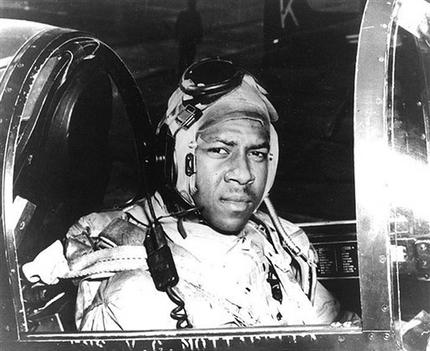 FILE - In this undated file photo from around 1950 provided by the U.S. Navy, Ensign Jesse Brown, who died in December 1950 after his plane crashed in North Korea, sits in a cockpit of his plane. Two years after he made history by becoming the Navy's first black pilot Brown lay trapped in his downed fighter plane in subfreezing North Korea, his leg broken and bleeding. His wingman crash-landed to try to save him, and even burned his hands trying to put out the flames. A chopper hovered nearby. Lt. j.g. Thomas Hudner could save himself, but not his friend. Hudner heads to Pyongyang on Saturday, July 20, 2013 with hopes of traveling in the coming week to the region known in North Korea as the Jangjin Reservoir, accompanied by soldiers from the Korean People's Army, to the spot where Brown died in December 1950. (AP Photo/U.S. Navy, File)