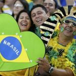 Fans of Brazil smile before the team's Confederations Cup final soccer match against Spain at the Estadio Maracana in Rio de Janeiro June 30, 2013. REUTERS/Kai Pfaffenbach