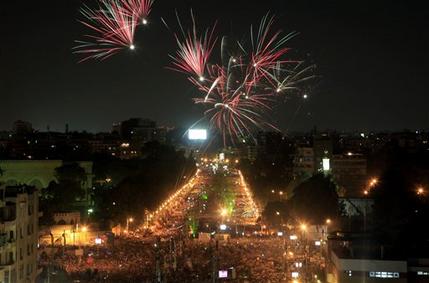 Fireworks light the sky as opponents of Egypt's Islamist President Mohammed Morsi protest outside the presidential palace in Cairo, Egypt, Monday, July 1, 2013. Egypt's powerful military warned on Monday it will intervene if the Islamist president doesn't "meet the people's demands," giving him and his opponents two days to reach an agreement in what it called a last chance. Hundreds of thousands of protesters massed for a second day calling on Mohammed Morsi to step down. (AP Photo/Khalil Hamra)