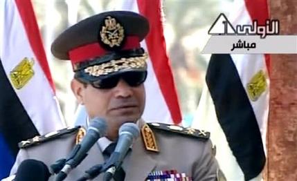 In this image taken from Egypt State TV, Egyptian Defense Minister Gen. Abdel-Fattah el-Sissi delivers a speech in Cairo, Egypt, Wednesday, July 24, 2013. El-Sissi has called on Egyptians to hold mass demonstrations to voice their support for the military to put an end to "violence" and "terrorism."( AP Photo/Egypt State TV)