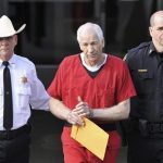 Jerry Sandusky (C) leaves the Centre County Courthouse after his sentencing in his child sex abuse case in Bellefonte, Pennsylvania October 9, 2012 file photo. REUTERS/Pat Little