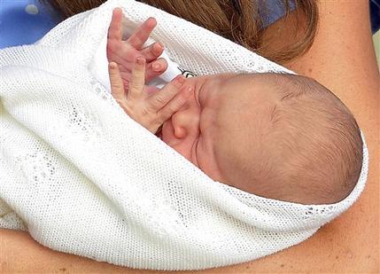 Kate, the Duchess of Cambridge, carries her new born son, the Prince of Cambridge, who was born on Monday. into public view for the first time. outside the Lindo Wing of St. Mary's Hospital, in London, Tuesday, July 23, 2013. The boy will be third in line to the British throne. (AP Photo/John Stillwell, Pool)