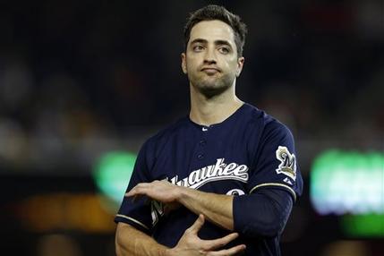 File-This Sept. 21, 2012 file photo shows Milwaukee Brewers Ryan Braun reacting while holding his elbow after missing his swing during a baseball game against the Washington Nationals at Nationals Park, in Washington.  Braun, a former National League MVP , has been suspended without pay for the rest of the season and admitted he "made mistakes" in violating Major Leauge Baseball's drug policies.  MLB Commissioner Bud Selig announced the penalty Monday July 22, 2013,  and released a statement by the Milwaukee Brewers slugger, who said: "I am not perfect. I realize now that I have made some mistakes. I am willing to accept the consequences of those actions." (AP Photo/Jacquelyn Martin, File)
