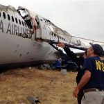 In this photo provided by the National Transportation Safety Board, on Tuesday, July 9, 2013, Investigator in Charge Bill English, foreground, and NTSB Chairwoman Deborah Hersman discuss the progress of the investigation into the crash of Asiana Airlines Flight 214 in San Francisco. The Asiana flight crashed upon landing Saturday, July 6, at San Francisco International Airport, and two of the 307 passengers aboard were killed. (AP Photo/National Transportation Safety Board)