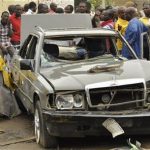 People gather at the site of an explosion at Sabon gari in Kano