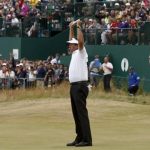 Phil Mickelson of the United States celebrates after his final putt on the 18th green during the final round of the British Open Golf Championship at Muirfield, Scotland, Sunday July 21, 2013. (AP Photo/Jon Super)