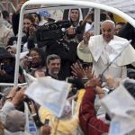 Pope Francis waves to pilgrims as he arrives to Aparecida Basilica in Aparecida, Brazil, Wednesday, July 24, 2013. Pope Francis, the first pontiff from the Americas, arrived to the basilica that holds Brazil's patron saint, the dark-skinned Virgin of Aparecida. (AP Photo/Andre Penner)