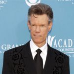 Singer Randy Travis arrives at the 45th annual Academy of Country Music Awards in Las Vegas, Nevada in this April 18, 2010 file photo. y to relieve pressure on his brain. He is in critical condition, according to a family spokesman. REUTERS/Steve Marcus/Files