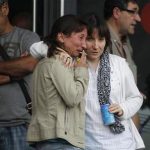 Relatives of victims involved in a train accident wait for news at a victims information point in Santiago de Compostela, Spain, on Thursday July 25, 2013. The death toll in a passenger train crash in northwestern Spain rose to 77 on Thursday after the train jumped the tracks on a curvy stretch just before arriving in the northwestern shrine city of Santiago de Compostela, a judicial official said. (AP Photo/Salome Montes)