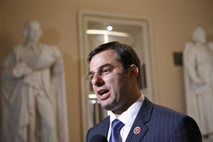 Rep. Justin Amash, R-Mich., comments about the vote on the defense spending bill and his failed amendment that would have cut funding to the National Security Agency's program that collects the phone records of U.S. citizens and residents, at the Capitol, Wednesday, July 24, 2013. The Amash Amendment narrowly lost, 217-205. The White House and congressional backers of the NSA's electronic surveillance program lobbied against ending the massive collection of phone records from millions of Americans saying it would put the nation at risk from another terrorist attack. (AP Photo/J. Scott Applewhite)