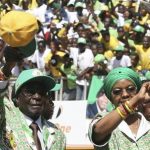 Zimbabwe's President Robert Mugabe and his wife Grace (R) arrive to address the final campaign rally of his ZANU-PF party in Harare July 28, 2013. Zimbabwe will hold general elections on July 31. REUTERS/Philimon Bulawayo