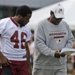 Running backs coach Bobby Turner, right, talks with Washington Redskins running back Alfred Morris (46)