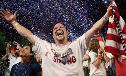 Scott Webb, of Waldorf, Md., celebrates during the finale of the Boston Pops Fourth of July Concert at the Hatch Shell in Boston, Thursday, July 4, 2013. (AP Photo/Michael Dwyer)