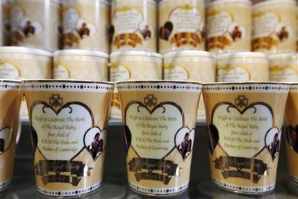 Souvenir cups to mark the forthcoming birth of Prince William and Kate, Duchess of Cambridge's baby are seen on display in a souvenir shop in central London, Wednesday, July 10, 2013. (AP Photo/Sang Tan)