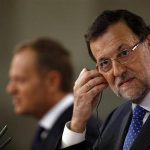 Spain's Prime Minister Mariano Rajoy adjusts his earphone during a joint news conference with his Polish counterpart Donald Tusk at Moncloa Palace in Madrid July 15, 2013. REUTERS/Sergio Perez