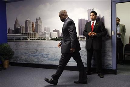 State-appointed emergency manager Kevyn Orr enters a news conference in Detroit, Mich., Thursday, July 18, 2013. State-appointed emergency manager Kevyn Orr asked a federal judge permission to place Detroit into Chapter 9 bankruptcy protection Thursday. (AP Photo/Paul Sancya)
