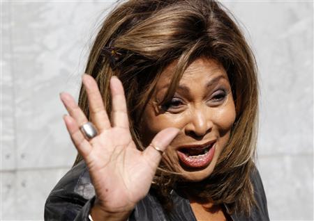 U.S. singer Tina Turner waves during a photocall before the Emporio Armani Autumn/Winter 2011 women's collection show at Milan Fashion Week February 26, 2011. REUTERS/Stefano Rellandini