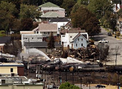 Wreckage is strewn through the downtown core in Lac-Megantic, Quebec, Monday, July 8, 2013, after a train derailed, igniting tanker cars carrying crude oil early Saturday. (AP Photo/The Canadian Press, Ryan Remiorz)