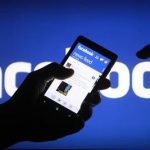 A smartphone user shows the Facebook application on his phone in the central Bosnian town of Zenica, in this photo illustration, May 2, 2013. REUTERS/Dado Ruvic