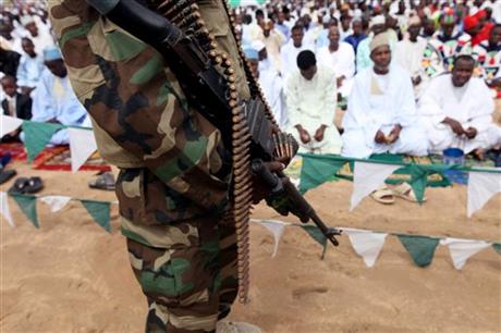 A Nigerian soldier provides security during Eid al-Fitr prayers at Ramat square in Maiduguri