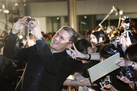 Actor Wentworth Miller takes a picture with fans at the "Resident Evil: Afterlife 3D" Tokyo premiere