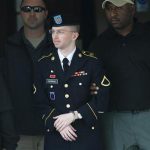 U.S. Army Pfc. Manning is escorted out of courthouse during his court martial at Fort Meade in Maryland