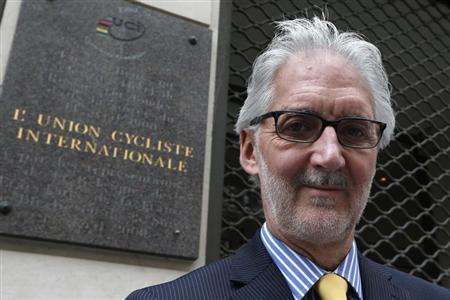 British Cycling President Brian Cookson poses in front of the building where the International Cycling Union was founded in Paris