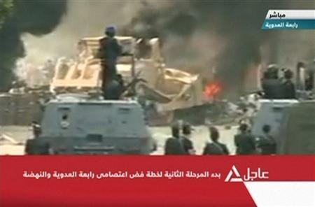 Still image taken from video shows a bulldozer demolishes a barricade at a protest camp set up by supporters of deposed Egyptian President Mohamed Mursi in Cairo