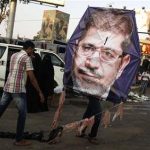 Supporters of deposed Egyptian President Mursi fly a kite in the sit-in area of Rab'a al- Adawiya Square
