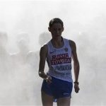 Lashmanova comes out of the cooling mist in the women's 20 km race walk final during the IAAF World Athletics Championships in Moscow