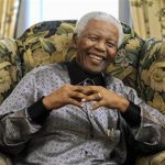 Former president of South Africa Mandela chats with Britain's Prime Minister Brown in London