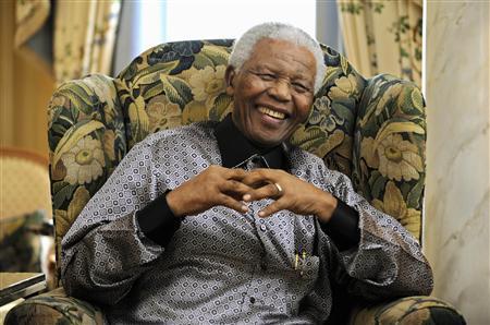 Former president of South Africa Mandela chats with Britain's Prime Minister Brown in London