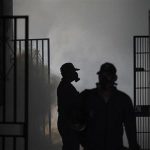Health workers fumigate a school in Tegucigalpa