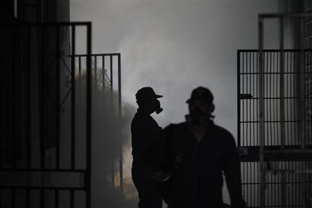 Health workers fumigate a school in Tegucigalpa