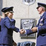 Handout photo of newly-named superintendent of the United States Air Force Academy Lt. Gen. Michelle Johnson shaking hands with Lt. Gen. Mike Gould in Colorado