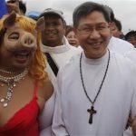 Manila's Archbishop Cardinal Tagle takes part in a protest against official corruption at Luneta park in Metro Manila