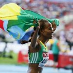 Defar of Ethiopia celebrates her victory in the women's 5000 metres final of the IAAF World Athletics Championships at the Luzhniki stadium in Moscow