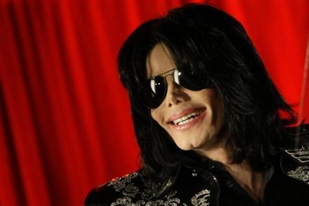 U.S. pop star Michael Jackson gestures during a news conference at the O2 Arena in London