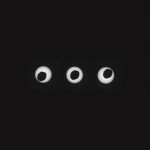 Phobos, the larger of Mars' two moons, is pictured in the midst of an annular eclipse of the sun