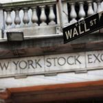 A Wall Street sign is seen in front of the New York Stock Exchange in New York's financial district