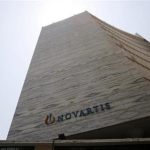 A Novartis logo is pictured on its headquarters building in Mumbai