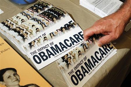 File photo of an Obamacare pamphlet at a Tea Party rally in Littleton