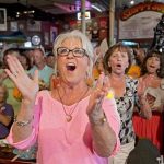 Food Network television personality Deen cheers for her husband during the semi-finals of the "Papa" Hemingway Look-Alike Contest at Sloppy Joe's Bar in Key West