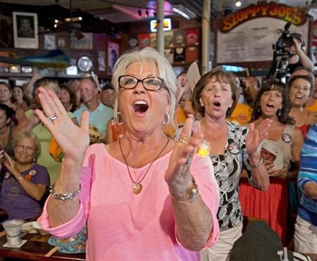 Food Network television personality Deen cheers for her husband during the semi-finals of the "Papa" Hemingway Look-Alike Contest at Sloppy Joe's Bar in Key West
