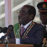 Zimbabwe's President Mugabe addresses supporters during celebrations to mark the country's Defence Forces Day in the capital Harare