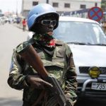 A U.N. peacekeeper patrols near the border crossing point between Rwanda and the Democratic Republic of Congo in Goma