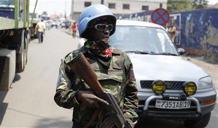 A U.N. peacekeeper patrols near the border crossing point between Rwanda and the Democratic Republic of Congo in Goma